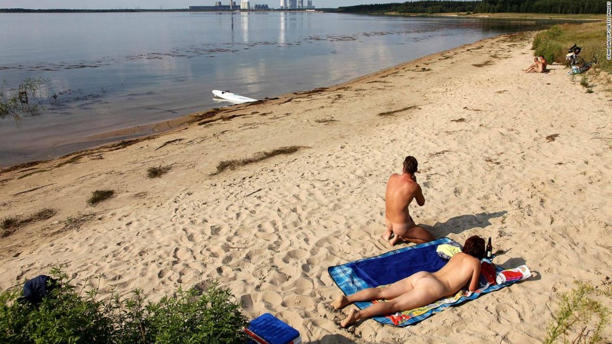 Russian nudist beach with couples sunbathing sweet