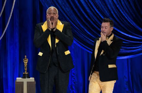 Travon Free, left, and Martin Desmond Roe accept the Oscar for the short film 'Two Distant Strangers.' Their shoes and the inside of their jackets carried the names of George Floyd, Breonna Taylor and other people killed by police violence. Todd Wawrychuk/AMPAS/Getty Images