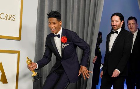 From left, Jon Batiste, Trent Reznor and Atticus Ross enter the press room after winning the Oscar for best original score ('Soul'). Chris Pizzelo/Pool/Getty Images