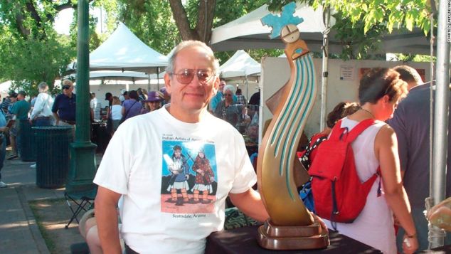 Artist Upton Greyshoes Ethelbah at his booth during the Santa Fe Indian Market.