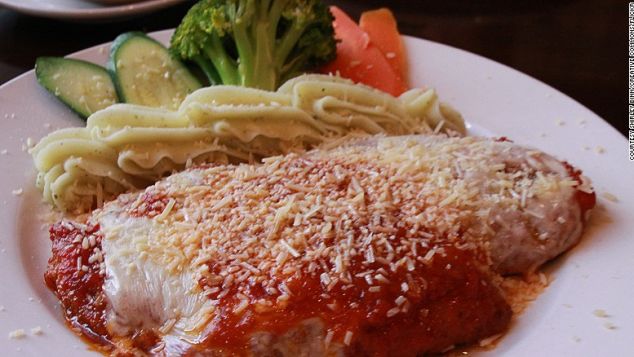 Australians have put their own stamp on chicken parmigiana. 