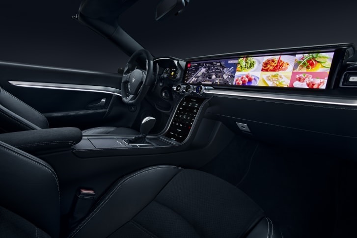 Harman's concept dashboard uses a 28-inch QLED widescreen display - although it can slide down into the fascia for a more subtle "strip screen" effect when it's not needed. 