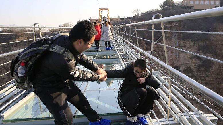 Spanning two mountains in the Hongyagu Scenic Area, the new bridge also has an added fear feature -- it sways. Image: Zhang Haiqiang/VCG via Getty Images